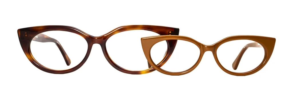 Two TIG frames shown front-on: one in XXL width and one in XXS width, illustrating the full size range available in our made-to-measure eyewear.